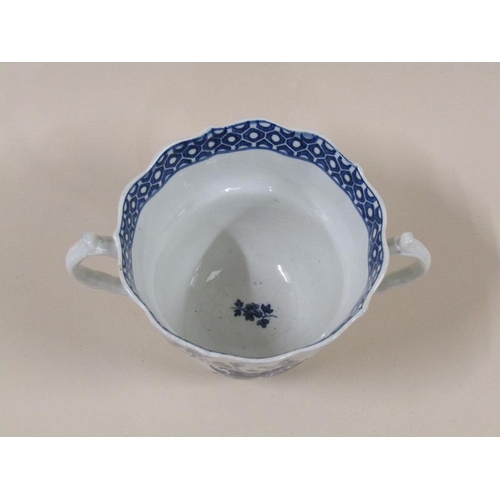 1969 - An 18c Worcester blue and white two handled tea cup and saucer decorated in 'Three Flowers' pattern ... 