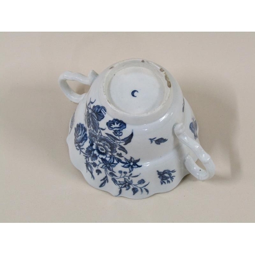 1969 - An 18c Worcester blue and white two handled tea cup and saucer decorated in 'Three Flowers' pattern ... 