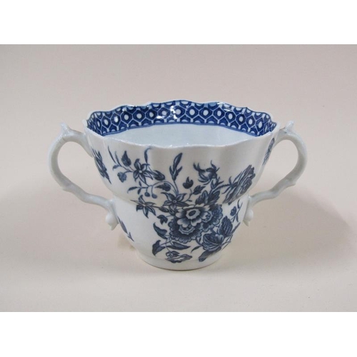 1969 - An 18c Worcester blue and white two handled tea cup and saucer decorated in 'Three Flowers' pattern ... 