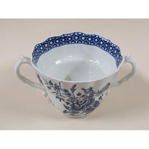 1969 - An 18c Worcester blue and white two handled tea cup and saucer decorated in 'Three Flowers' pattern ... 