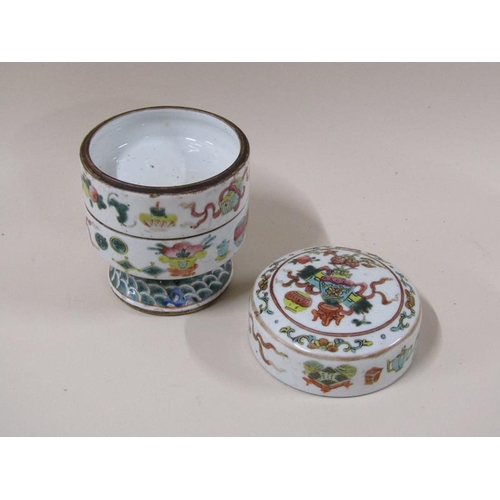 1980 - An Oriental two compartment famille verte stacking jar, character mark to base, 15cm h.