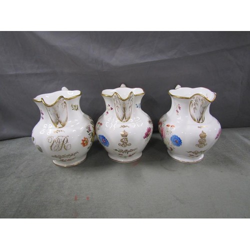 1972 - Three Coalport Royal Commemorative jugs with floral decoration and gilding, with syphers for Queen V... 