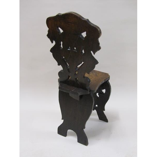 2020 - A 19c Italian Sgabello side chair, the back carved with winged lions with shaped seat and mask carve... 