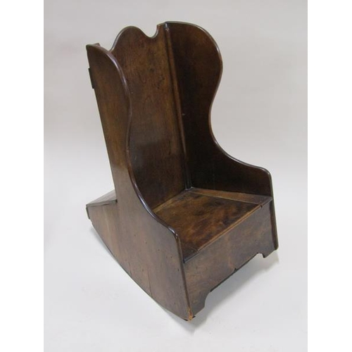 2026 - A 19c mahogany child's box seat wingback rocking chair, 65cm h.