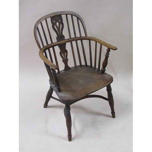 2037 - A mid 19c Windsor ash and yew wood hooped spindle back armchair with a pierced vase splat, shaped se... 