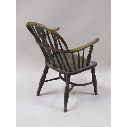 2037 - A mid 19c Windsor ash and yew wood hooped spindle back armchair with a pierced vase splat, shaped se... 