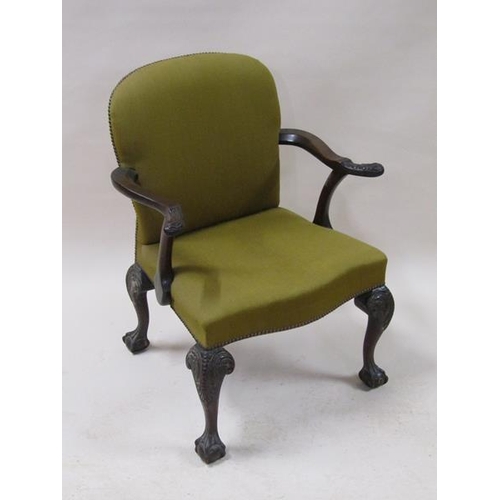 2039 - A mid Georgian style mahogany open armchair with scrolling arms, having leaf carved terminals with s... 