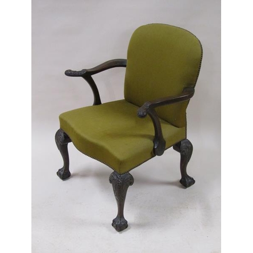 2039 - A mid Georgian style mahogany open armchair with scrolling arms, having leaf carved terminals with s... 