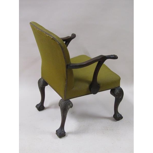 2039 - A mid Georgian style mahogany open armchair with scrolling arms, having leaf carved terminals with s... 