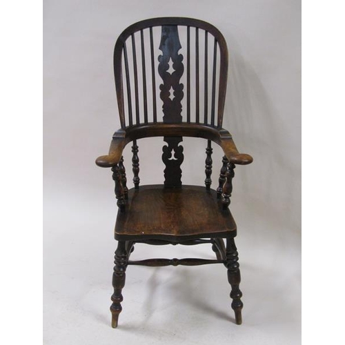 2040 - A Victorian Windsor ash and elm hoop spindle back armchair with bold turned and baluster carved legs... 