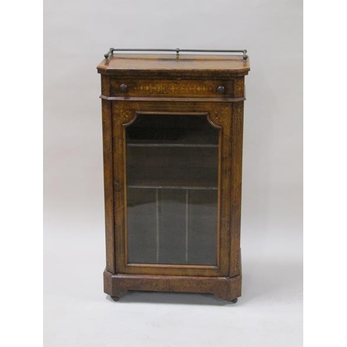 2043 - A mid Victorian figured walnut marquetry decorated music cabinet with upper drawer over a shelved ca... 