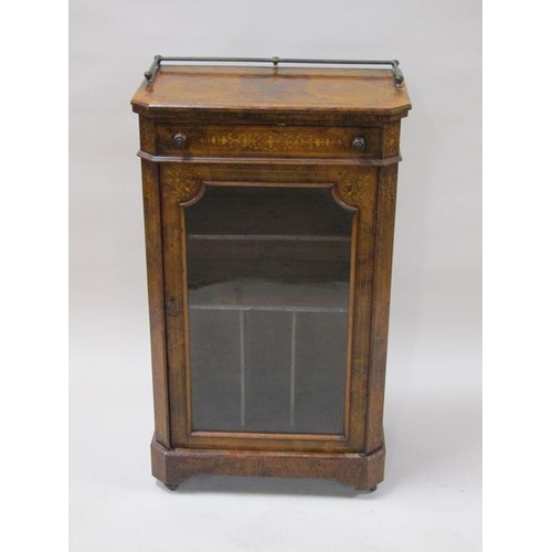 2043 - A mid Victorian figured walnut marquetry decorated music cabinet with upper drawer over a shelved ca... 