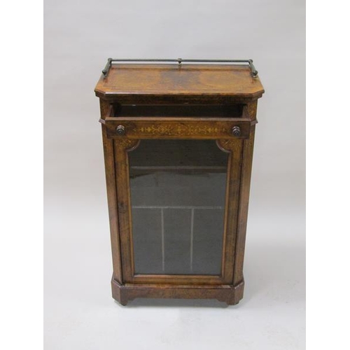 2043 - A mid Victorian figured walnut marquetry decorated music cabinet with upper drawer over a shelved ca... 