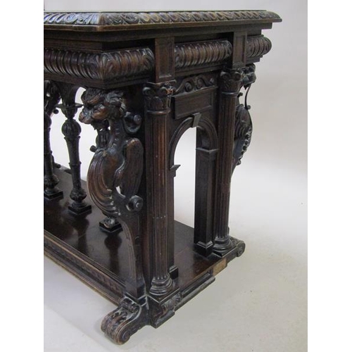 2067 - A 19c oak centre table of rectangular form, the table edge and frieze lunette carved and supported o... 