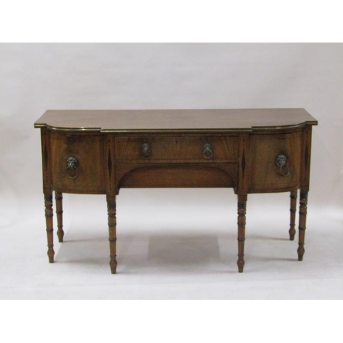 2071 - An early 19c mahogany sideboard with a central frieze drawer over a lower pull out drawer with arche... 