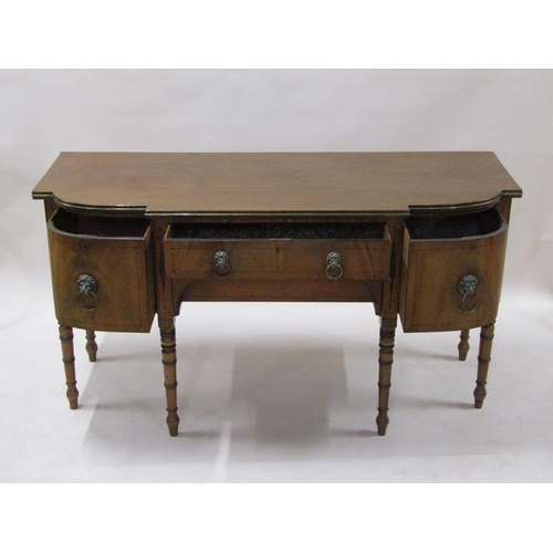 2071 - An early 19c mahogany sideboard with a central frieze drawer over a lower pull out drawer with arche... 