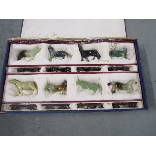 1442 - Cased set of carved Jadeite horses, each appx 9cms w in box