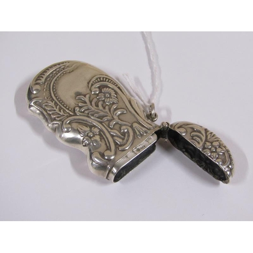 1512 - Silver vesta case of shaped form, embossed with leaf and scroll work, 6.5cm l.