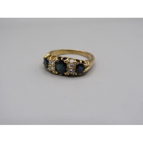 1609 - An 18ct gold sapphire and diamond set ring, size L/M.