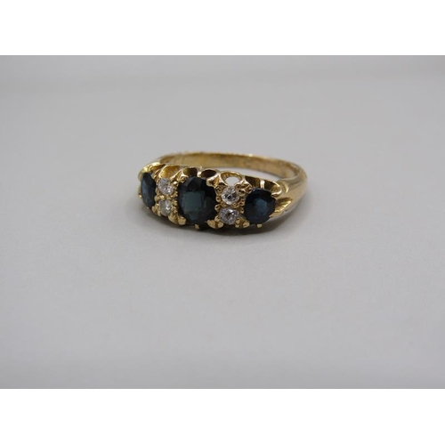 1609 - An 18ct gold sapphire and diamond set ring, size L/M.