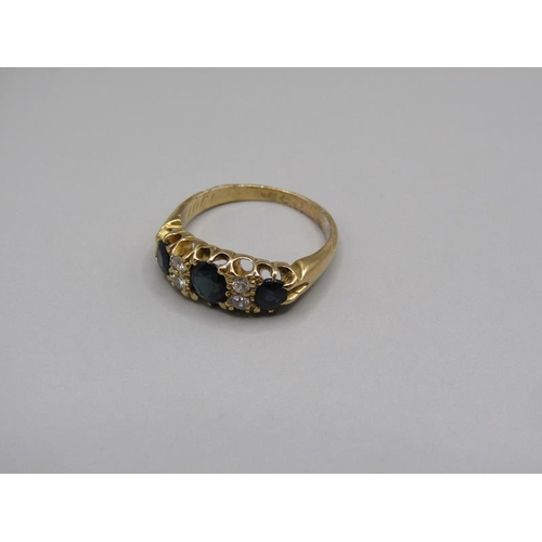 1609 - An 18ct gold sapphire and diamond set ring, size L/M.