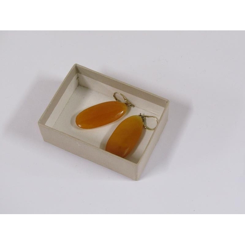 1618 - A pair of 14ct gold amber drop earrings.