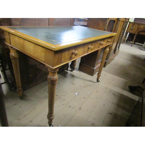 2057 - An Edwardian Holland & Sons satinwood two drawer writing desk with green tooled leather insert and s... 