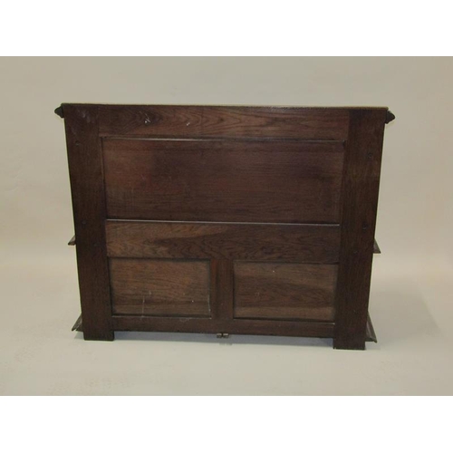 2014 - A Victorian oak box seat, the panel profusely carved with a central warrior flanked by scrolling lea... 