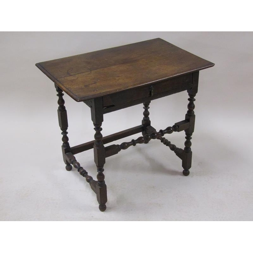 2015 - An 18c oak side table of rectangular form with moulded edge, fitted one long frieze drawer supported... 