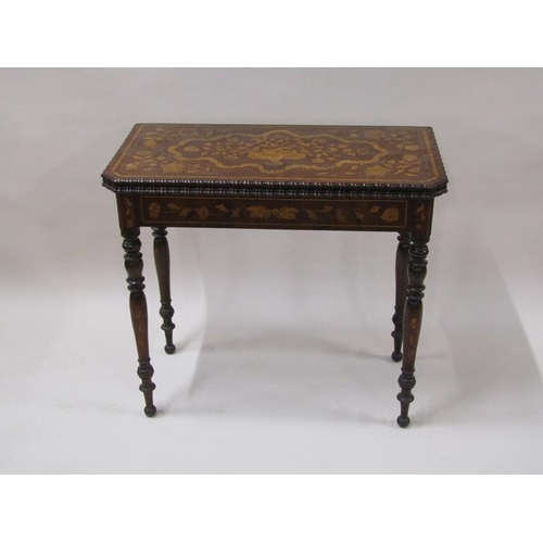 2055 - An early 19c mahogany marquetry decorated fold over card table, the open top with trump card corners... 