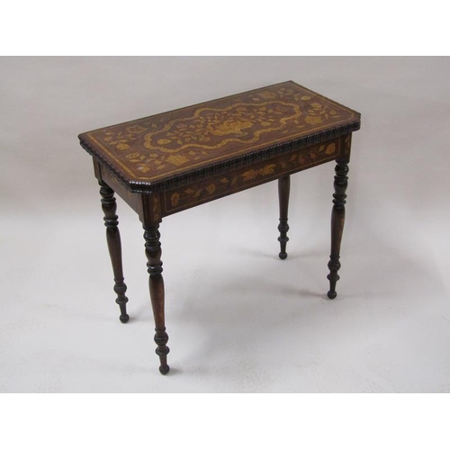 2055 - An early 19c mahogany marquetry decorated fold over card table, the open top with trump card corners... 