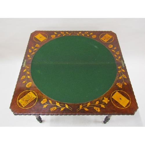 2055 - An early 19c mahogany marquetry decorated fold over card table, the open top with trump card corners... 