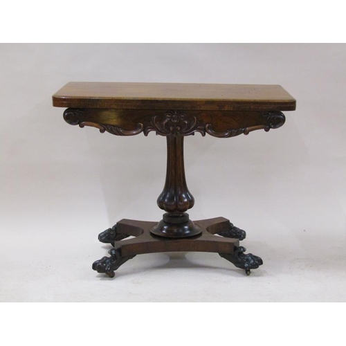 2059 - A William IV rosewood fold over card table with a deep carved and moulded frieze, supported on a lob... 