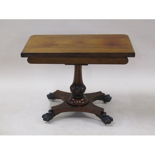 2059 - A William IV rosewood fold over card table with a deep carved and moulded frieze, supported on a lob... 