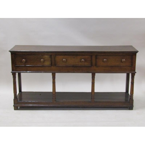 2068 - A late 18c/early 19c English oak three drawer dresser base with pot board, supported on ring turned ... 