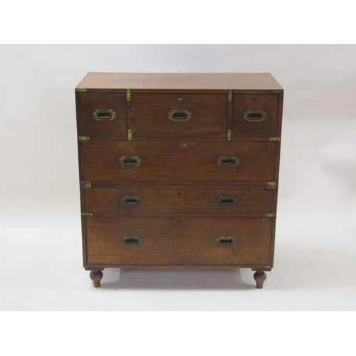 2069 - A 19c mahogany military chest of split construction, having a central secretaire with fall front and... 