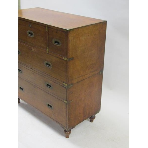 2069 - A 19c mahogany military chest of split construction, having a central secretaire with fall front and... 