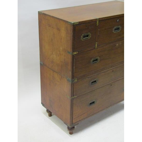 2069 - A 19c mahogany military chest of split construction, having a central secretaire with fall front and... 