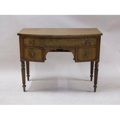 2073 - An early 19c mahogany bow front kneehole side table, having one long drawer over two short flanking ... 