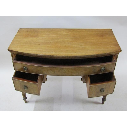 2073 - An early 19c mahogany bow front kneehole side table, having one long drawer over two short flanking ... 