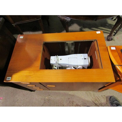 601 - SEWING MACHINE IN CABINET