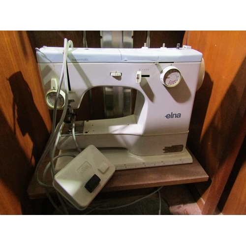 601 - SEWING MACHINE IN CABINET