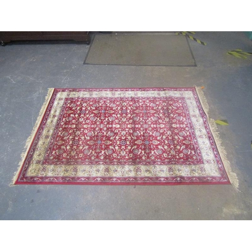 1784 - RED GROUND KASHMIR FLORAL DESIGN RUG 170CM X 120CM