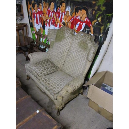 699 - EARLY 20c TWO SEATER WINGBACK SOFA