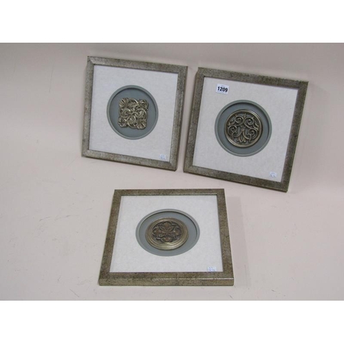 1209 - THREE FRAMED CELTIC EMBLEMS, FRAMES 27cms SQ