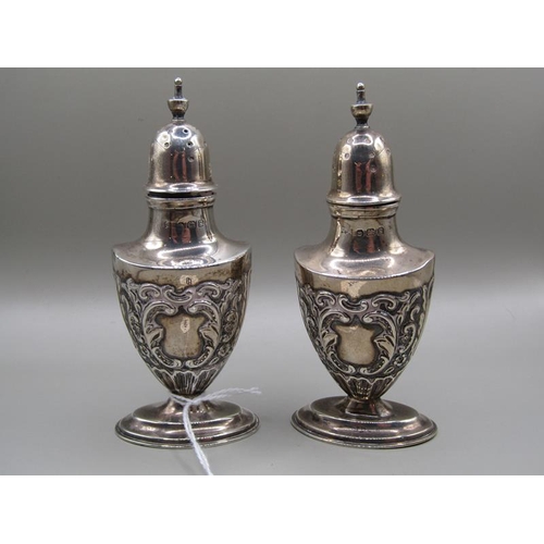 1249 - PAIR OF EMBOSSED SILVER PEPPERETTES