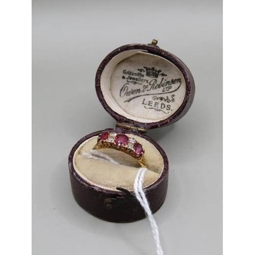 1303 - 18ct GOLD RUBY AND DIAMOND SET RING - SIZE M