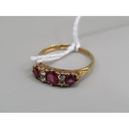 1303 - 18ct GOLD RUBY AND DIAMOND SET RING - SIZE M