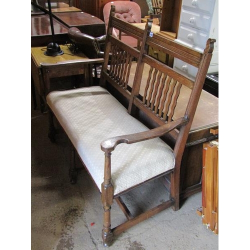 568 - EDWARDIAN OAK TWO SEATER SETTEE