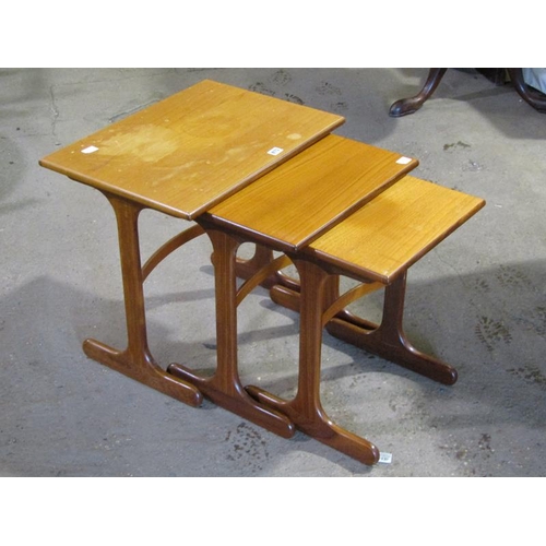 873 - NEST OF THREE TEAK TABLES; TEAK COFFEE TABLE